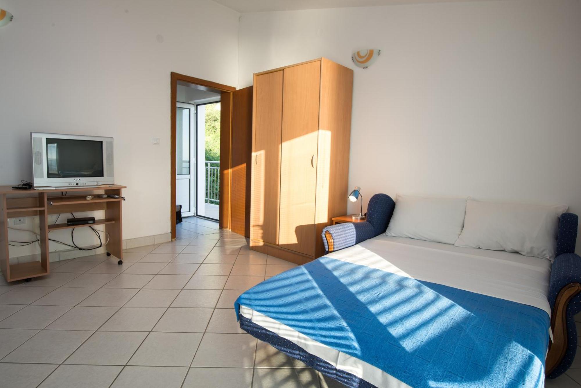 Apartments Dragisic Ilha Sveti Stefan Quarto foto